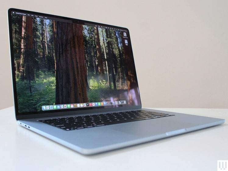 Front view of an open MacBook Air M.4. 15-Inch 2025, a thin silver laptop, showing the screen, keyboard, and touchpad.